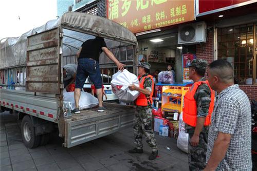 缪力同心驱“洪兽”  灾后重建众志成城