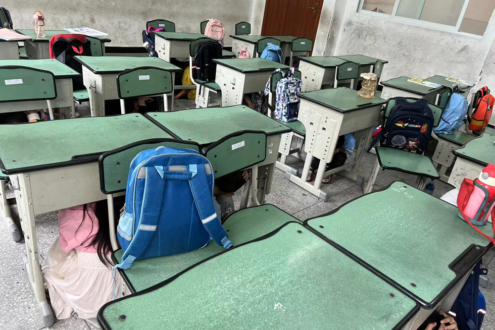 广安区兴平小学开展防震应急疏散演练活动